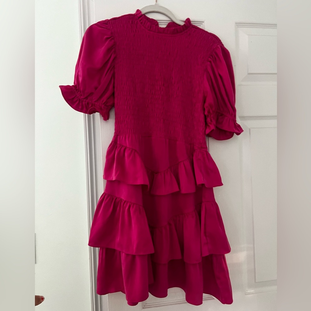 A pink karlie dress that zips in the back, it’s also high neck and fittted top